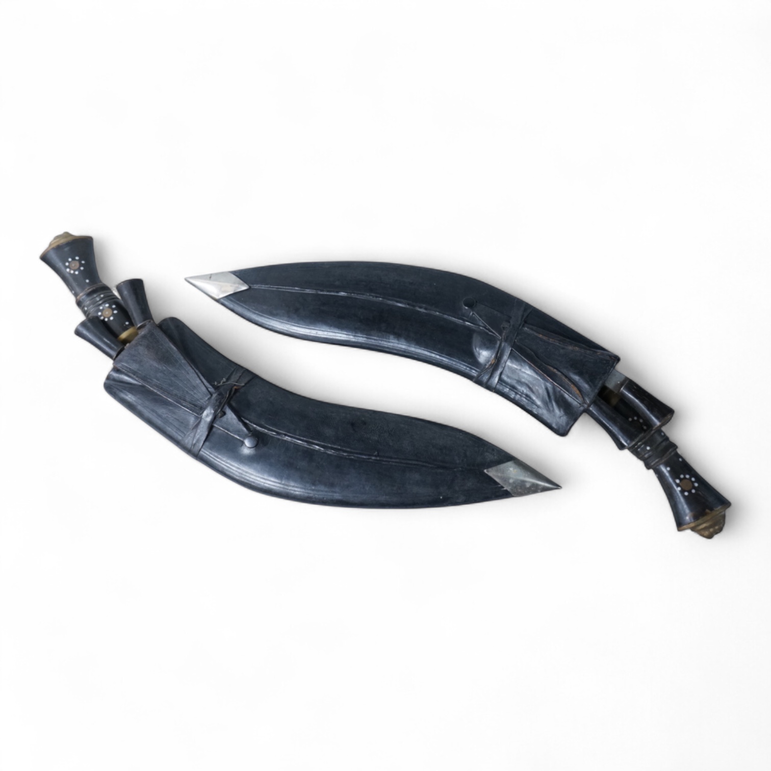 Two kukri knives in leather covered scabbards